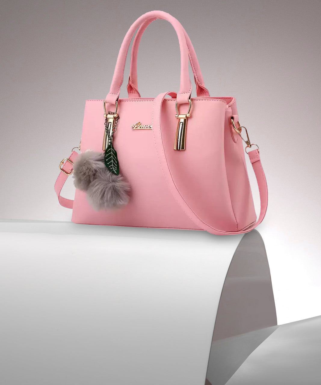 Stylish Pink PU Leather Handbag for Women | Adjustable Handle, Golden Buckle & Pom-Pom Charm